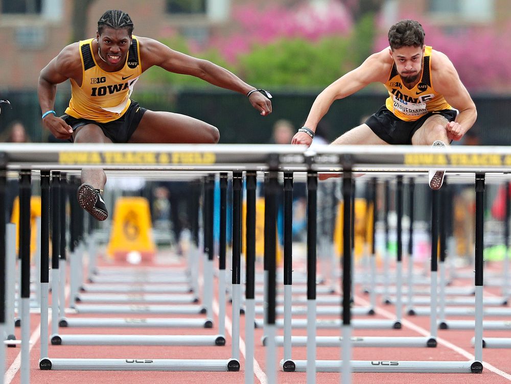 Iowa's Anthony Williams (from left) and Josh Braverman run the men’s 110 meter hurdles event on the third day of the Big Ten Outdoor Track and Field Championships at Francis X. Cretzmeyer Track in Iowa City on Sunday, May. 12, 2019. (Stephen Mally/hawkeyesports.com)
