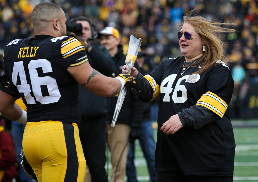 Iowa Hawkeyes fullback Austin Kelly (46) is greeted by his mother during Senior Day ceremonies before a game against Nebraska at Kinnick Stadium on November 23, 2018. (Tork Mason/hawkeyesports.com)