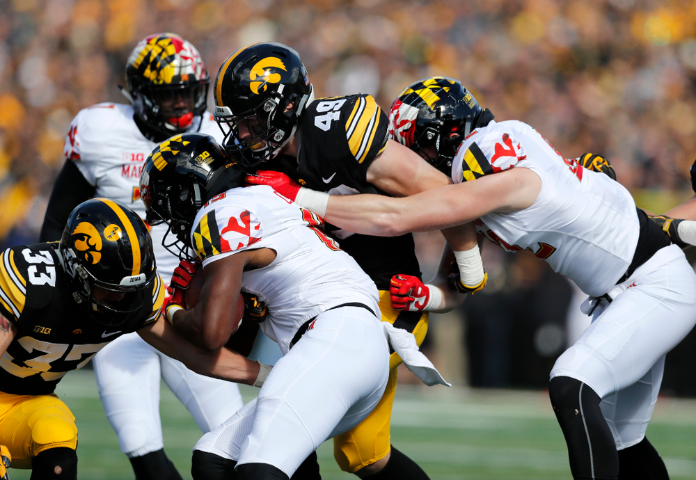 Iowa Hawkeyes linebacker Nick Niemann (49) and defensive back Riley Moss (33) against the Maryland Terrapins Saturday, October 20, 2018 at Kinnick Stadium (Brian Ray/hawkeyesports.com)