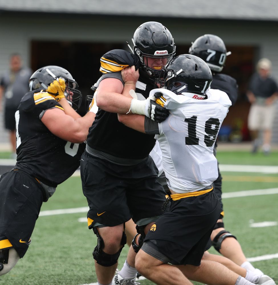 Iowa Hawkeyes offensive lineman Matt Fagan (54) and linebacker Mike Timm (19) and during practice No. 4 of Fall Camp Monday, August 6, 2018 at the Hansen Football Performance Center. (Brian Ray/hawkeyesports.com)
