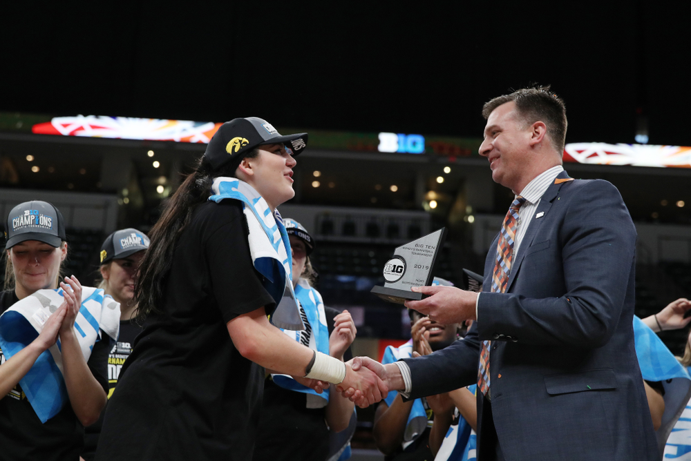 Iowa Hawkeyes forward Megan Gustafson (10) receives the Most Outstanding Player Award following their win against the Maryland Terrapins Sunday, March 10, 2019 at Bankers Life Fieldhouse in Indianapolis, Ind. (Brian Ray/hawkeyesports.com)