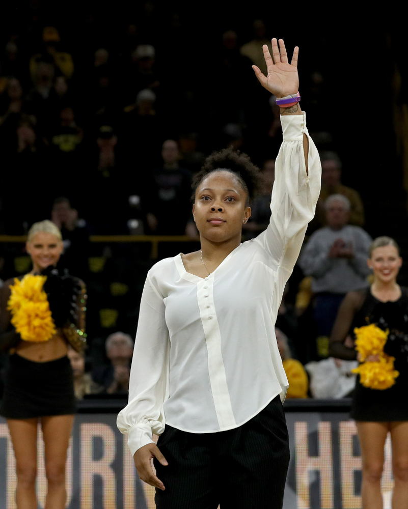 Former Hawkeye and Clemson graduate assistant Tania Davis waves to the fans after being introduced before their game Wednesday, December 4, 2019 at Carver-Hawkeye Arena. (Brian Ray/hawkeyesports.com)