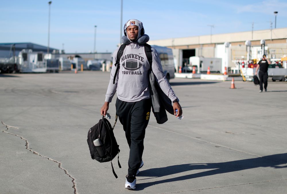 Iowa Hawkeyes defensive end Chauncey Golston (57) boards the team plane at the Eastern Iowa Airport Saturday, December 21, 2019 on the way to San Diego, CA for the Holiday Bowl. (Brian Ray/hawkeyesports.com)