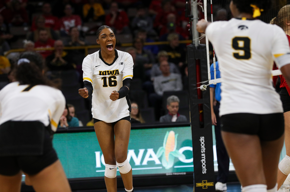 Iowa Hawkeyes outside hitter Taylor Louis (16) celebrates after winning a point during a match against Nebraska at Carver-Hawkeye Arena on November 7, 2018. (Tork Mason/hawkeyesports.com)