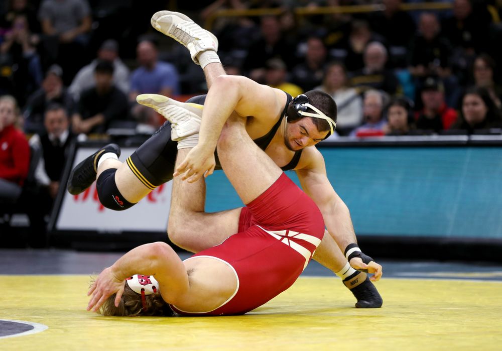 IowaÕs Tony Cassioppi wrestles WisconsinÕs Trent Hillger at heavyweight Sunday, December 1, 2019 at Carver-Hawkeye Arena. Cassioppi won the match 3-2. (Brian Ray/hawkeyesports.com)