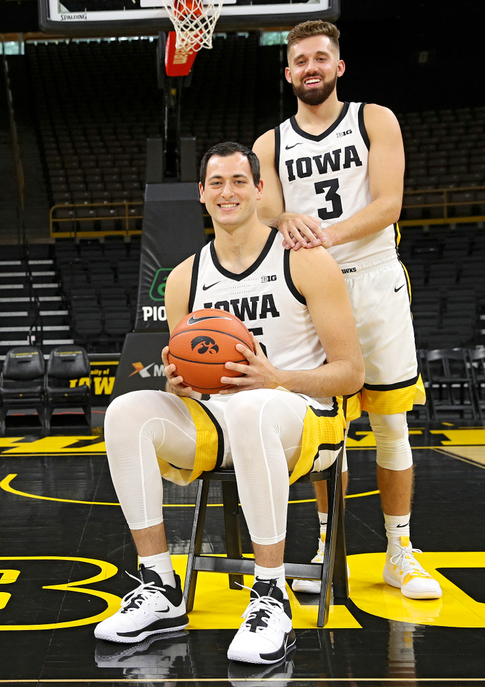 Iowa Hawkeyes forward Ryan Kriener (15) and guard Jordan Bohannon (3) pose for a photo during Iowa Men’s Basketball Media Day at Carver-Hawkeye Arena in Iowa City on Wednesday, Oct 9, 2019. (Stephen Mally/hawkeyesports.com)