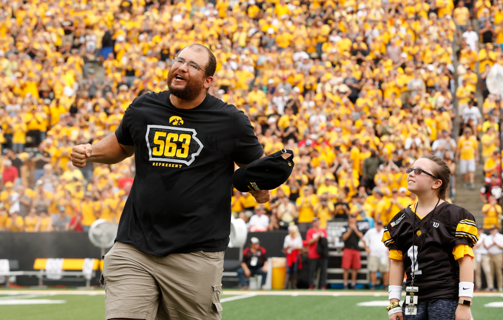 Honorary Captain Julian Vandervelde and the kid captain against the Northern Illinois Huskies Saturday, September 1, 2018 at Kinnick Stadium. (Brian Ray/hawkeyesports.com)