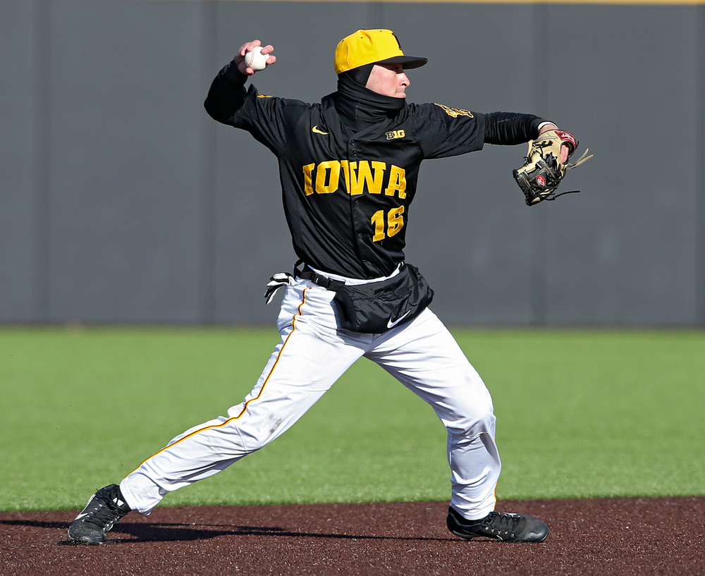 Iowa Hawkeyes shortstop Tanner Wetrich (16) throws to first base for an out during the ninth inning of their game against Illinois at Duane Banks Field in Iowa City on Saturday, Mar. 30, 2019. (Stephen Mally/hawkeyesports.com)