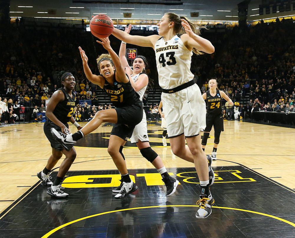 Iowa Hawkeyes forward Amanda Ollinger (43) pulls in a rebound during the second quarter of their second round game in the 2019 NCAA Women's Basketball Tournament at Carver Hawkeye Arena in Iowa City on Sunday, Mar. 24, 2019. (Stephen Mally for hawkeyesports.com)