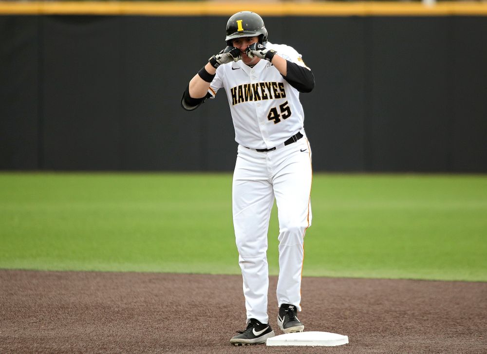 Iowa first baseman Peyton Williams (45) celebrates on second base after hitting a double during the first inning of their college baseball game at Duane Banks Field in Iowa City on Wednesday, March 11, 2020. (Stephen Mally/hawkeyesports.com)