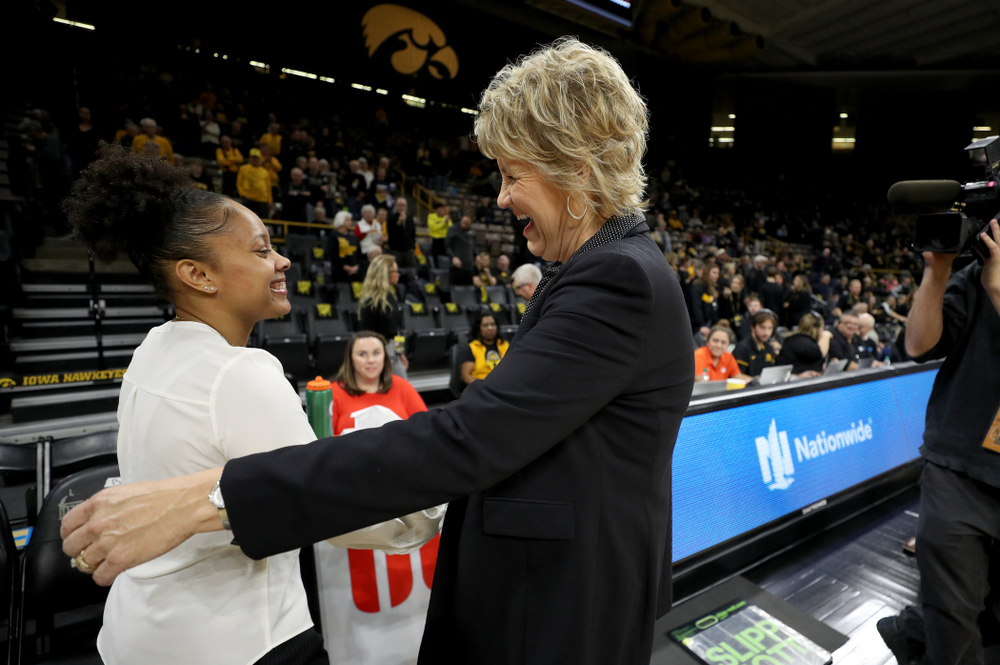 Former Hawkeye and Clemson graduate assistant Tania Davis hugs Iowa Hawkeyes head coach Lisa Bluder before their game Wednesday, December 4, 2019 at Carver-Hawkeye Arena. (Brian Ray/hawkeyesports.com)
