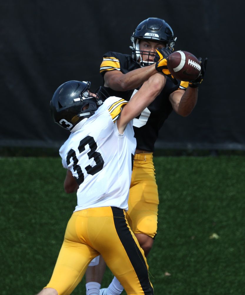 Iowa Hawkeyes defensive back Riley Moss (33) and wide receiver Oliver Martin (5) during Fall Camp Practice No. 5 Tuesday, August 6, 2019 at the Ronald D. and Margaret L. Kenyon Football Practice Facility. (Brian Ray/hawkeyesports.com)