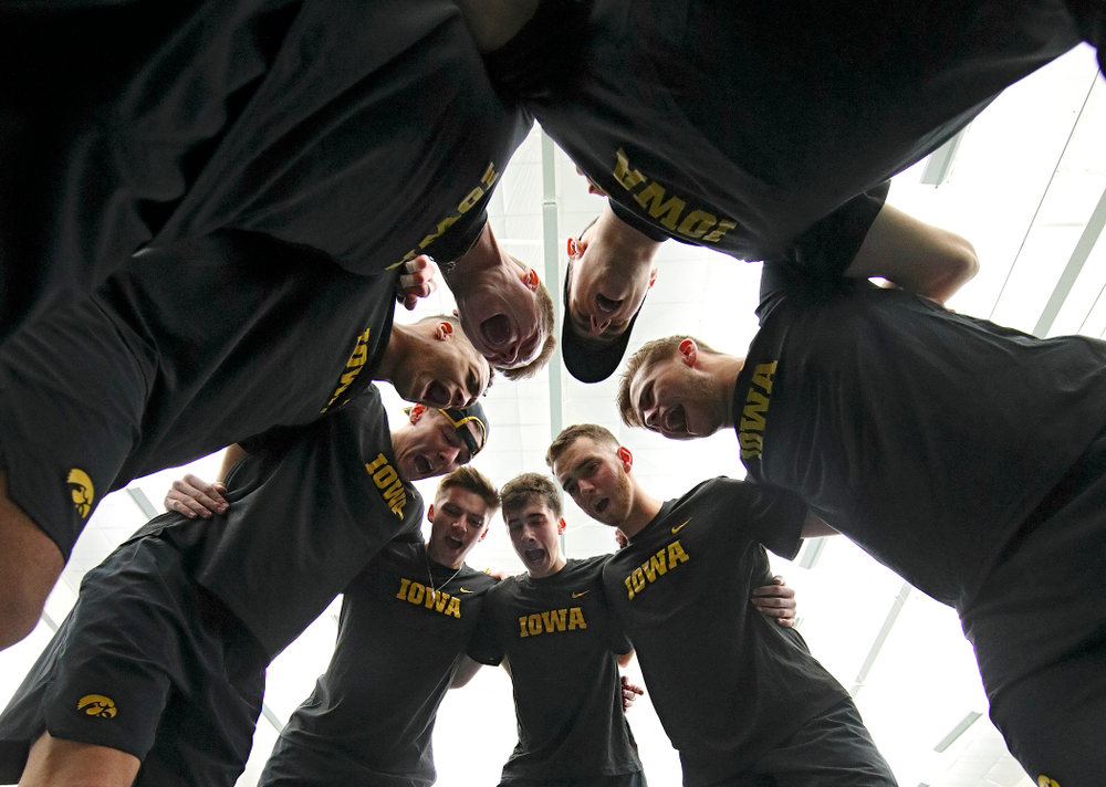 The Hawkeyes huddle before their match at the Hawkeye Tennis and Recreation Complex in Iowa City on Friday, February 14, 2020. (Stephen Mally/hawkeyesports.com)