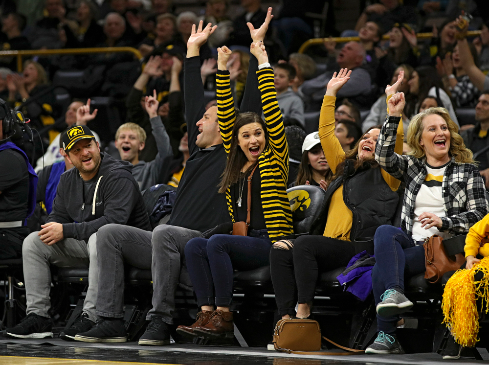 Iowa fans cheer after a fan made a putt across the court during a timeout in the first half of their game at Carver-Hawkeye Arena in Iowa City on Friday, Nov 8, 2019. (Stephen Mally/hawkeyesports.com)