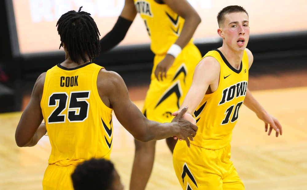 Iowa Hawkeyes guard Joe Wieskamp (10) high-fives Iowa Hawkeyes forward Tyler Cook (25) after making a shot against Wisconsin on November 30, 2018 at Carver-Hawkeye Arena. (Tork Mason/hawkeyesports.com)