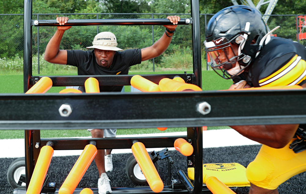 Iowa Hawkeyes running backs coach Derrick Foster looks on as running back Mekhi Sargent (10) runs a drill during Fall Camp Practice No. 11 at the Hansen Football Performance Center in Iowa City on Wednesday, Aug 14, 2019. (Stephen Mally/hawkeyesports.com)