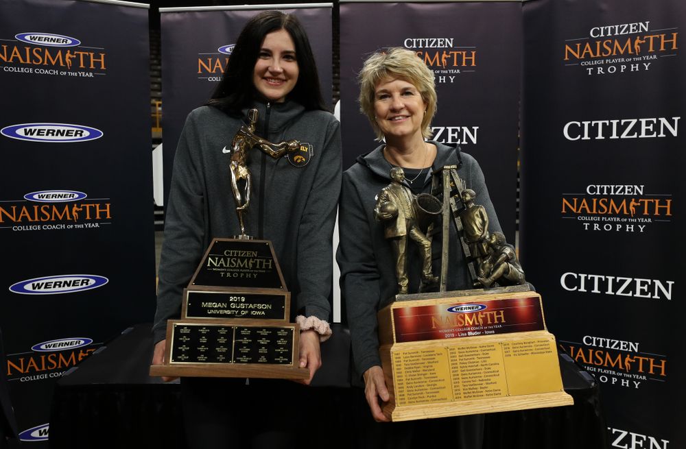 Iowa Hawkeyes forward Megan Gustafson (10) with the Naismith Player Of The Year Trophy and head coach Lisa Bluder with the Naismith Coach Of the Year Trophy during the teamÕs Celebr-Eight event Wednesday, April 24, 2019 at Carver-Hawkeye Arena. (Brian Ray/hawkeyesports.com)