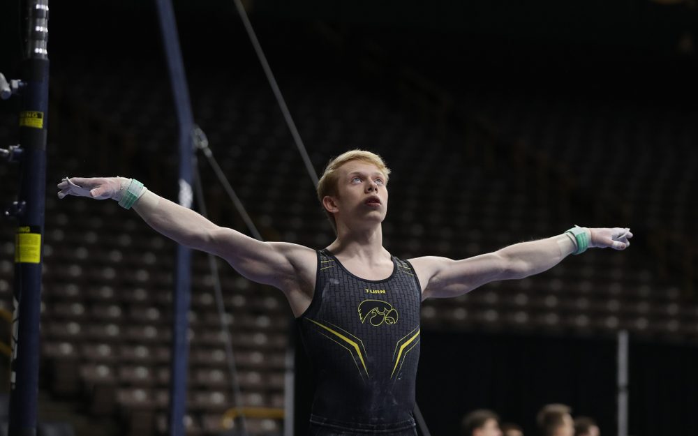 Iowa's Nick Merryman competes on the high bar against the Ohio State Buckeyes Saturday, March 16, 2019 at Carver-Hawkeye Arena. (Brian Ray/hawkeyesports.com)