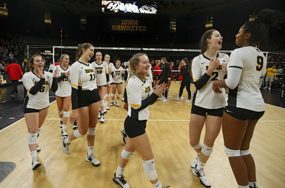 The Hawkeyes celebrate after winning their match at Carver-Hawkeye Arena in Iowa City on Saturday, Nov 30, 2019. (Stephen Mally/hawkeyesports.com)