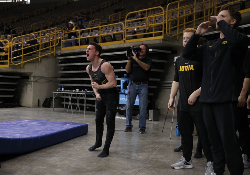 Iowa's Jake Brodarzon cheers on his teammates during their meet against the Ohio State Buckeyes Saturday, March 16, 2019 at Carver-Hawkeye Arena. (Brian Ray/hawkeyesports.com)