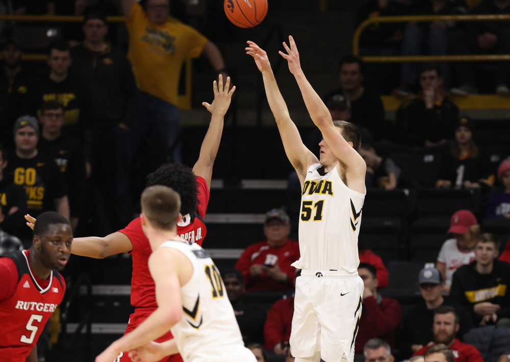 Iowa Hawkeyes forward Nicholas Baer (51) knocks down a three point basket against the Rutgers Scarlet Knights Saturday, March 2, 2019 at Carver-Hawkeye Arena. (Brian Ray/hawkeyesports.com)