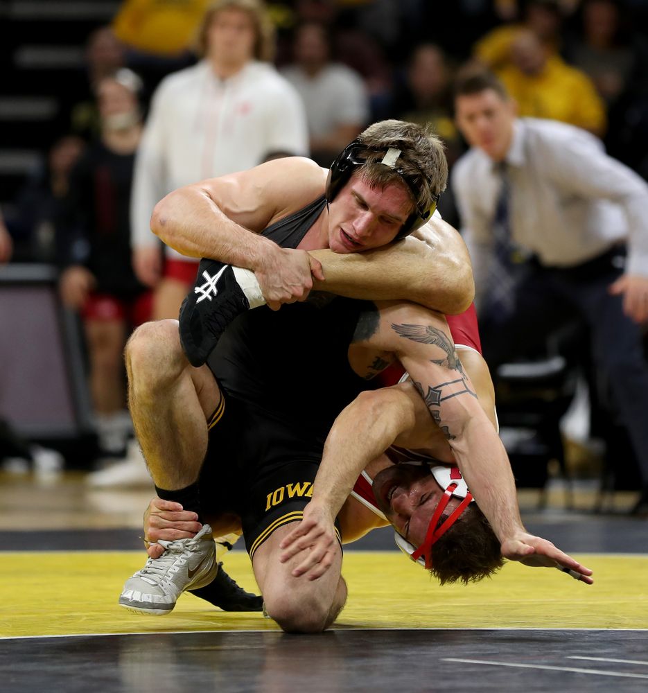 IowaÕs Cash Wilcke wrestles WisconsinÕs Johnny Sebastian at 184 pounds Sunday, December 1, 2019 at Carver-Hawkeye Arena. Sebastian won the match in overtime 7-5. (Brian Ray/hawkeyesports.com)