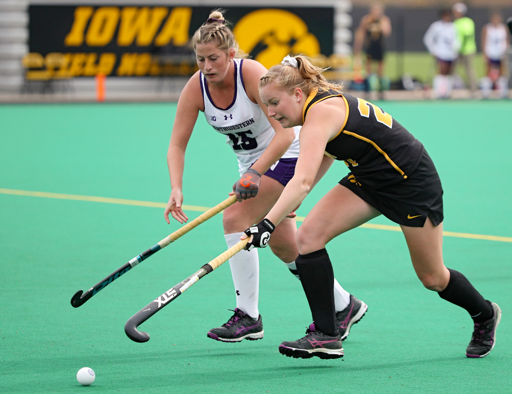 Iowa’s Makenna Maguire (21) stretches out for the ball during the first quarter of their game at Grant Field in Iowa City on Saturday, Oct 26, 2019. (Stephen Mally/hawkeyesports.com)