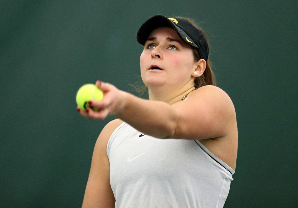 Iowa’s Danielle Bauers serves during her singles match at the Hawkeye Tennis and Recreation Complex in Iowa City on Sunday, February 16, 2020. (Stephen Mally/hawkeyesports.com)