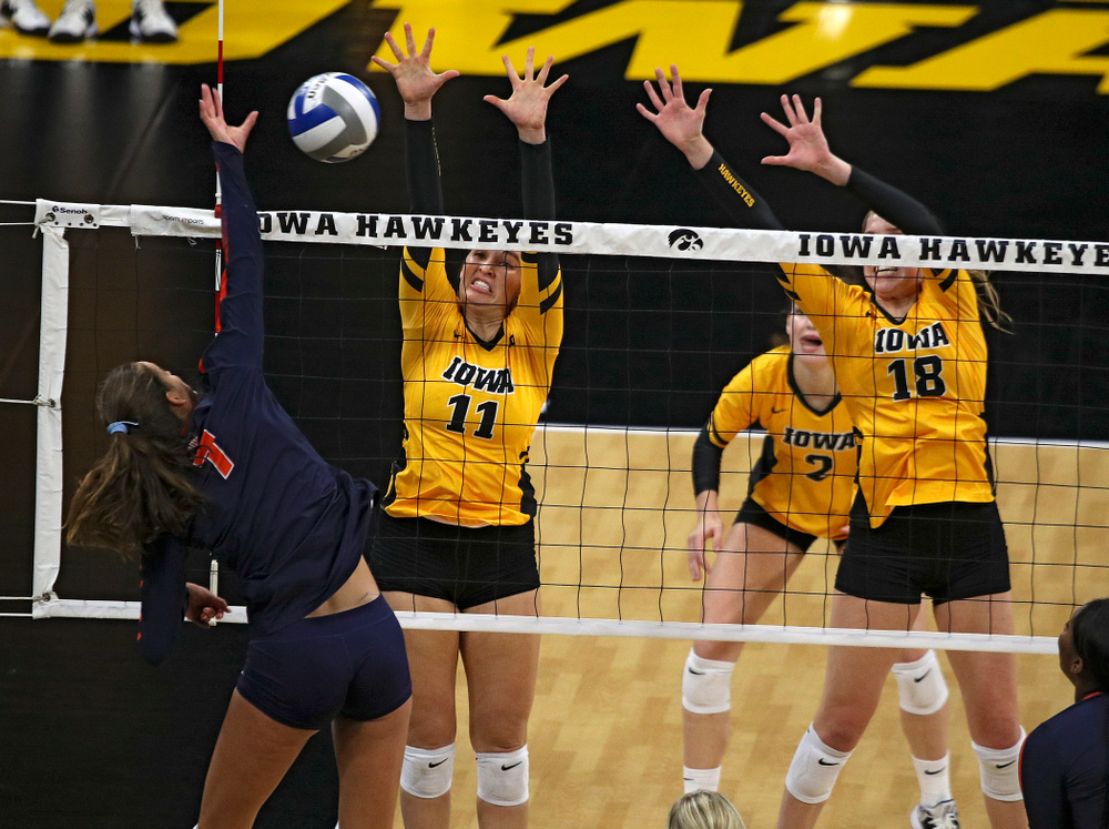 Iowa’s Blythe Rients (11) and Hannah Clayton (18) try for a block during the first set of their match against Illinois at Carver-Hawkeye Arena in Iowa City on Wednesday, Nov 6, 2019. (Stephen Mally/hawkeyesports.com)