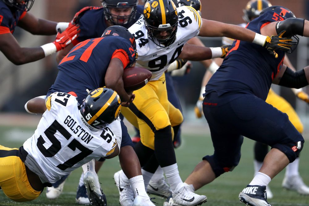 Iowa Hawkeyes defensive end A.J. Epenesa (94) and defensive end Chauncey Golston (57) cause a fumble against the Illinois Fighting Illini Saturday, November 17, 2018 at Memorial Stadium in Champaign, Ill. (Brian Ray/hawkeyesports.com)