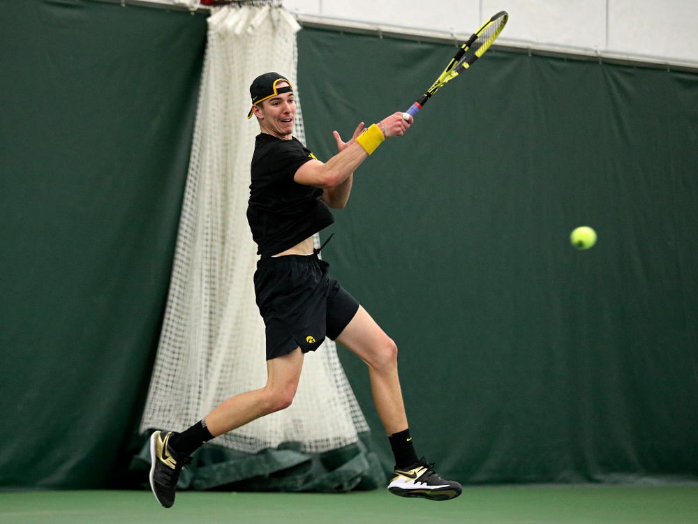 Iowa’s Nikita Snezhko returns a shot during his singles match at the Hawkeye Tennis and Recreation Complex in Iowa City on Friday, March 6, 2020. (Stephen Mally/hawkeyesports.com)