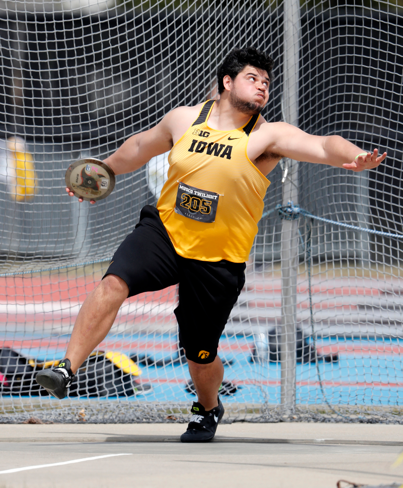 Iowa's Reno Tuufuli competes in the discus during the 2018 MUSCO Twilight Invitational Thursday, April 12, 2018 at the Cretzmeyer Track. (B