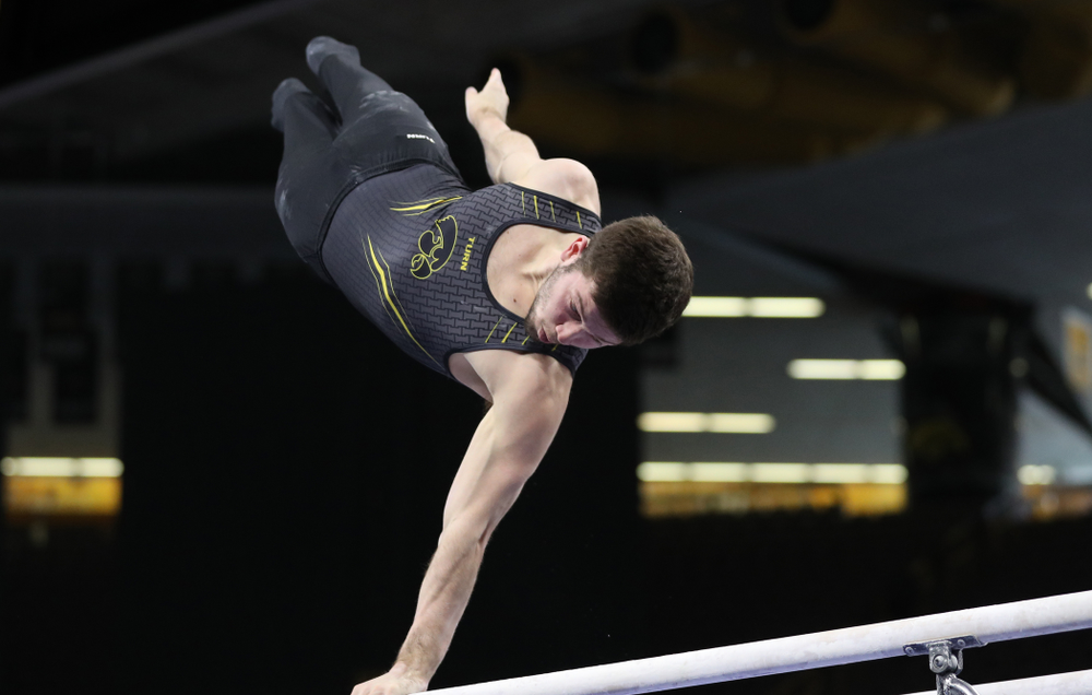Iowa's Rogelio Vazquez competes on the parallel bars against the Ohio State Buckeyes Saturday, March 16, 2019 at Carver-Hawkeye Arena. (Brian Ray/hawkeyesports.com)