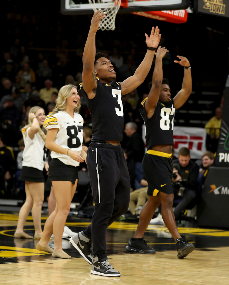 Members of the Hawkeye Football team performs with the Iowa Dance Team at halftime of the Iowa Hawkeyes game against the Ohio State Buckeyes Thursday, February 20, 2020 at Carver-Hawkeye Arena. (Brian Ray/hawkeyesports.com)