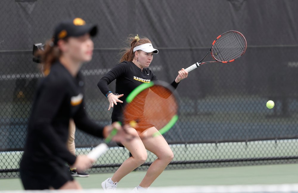 Elise Van Heuvelen and Anastasia Reimchen play a doubles match against the Wisconsin Badgers Sunday, April 22, 2018 at the Hawkeye Tennis and Recreation Center. (Brian Ray/hawkeyesports.com)