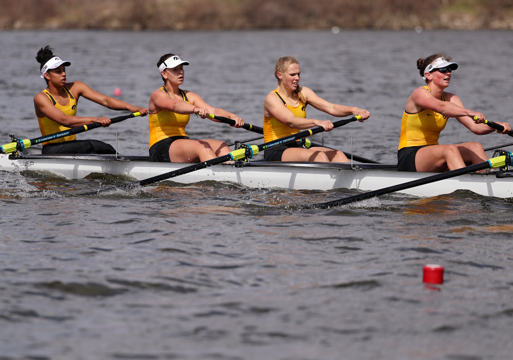 Iowa's Naomi Visser (from left), Elena Waiglein, Paige Schlapkohl, and Hannah Greenlee during their 1 Varsity 8 race against Wisconsin in their Big Ten Double Dual Rowing Regatta at Lake Macbride in Solon on Saturday, Apr. 13, 2019. (Stephen Mally/hawkeyesports.com)