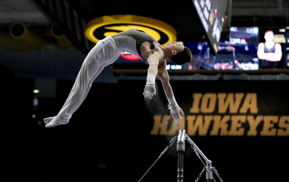 Iowa’s Mitch Mandozzi competes on the high bar against Illinois Sunday, March 1, 2020 at Carver-Hawkeye Arena. (Brian Ray/hawkeyesports.com)
