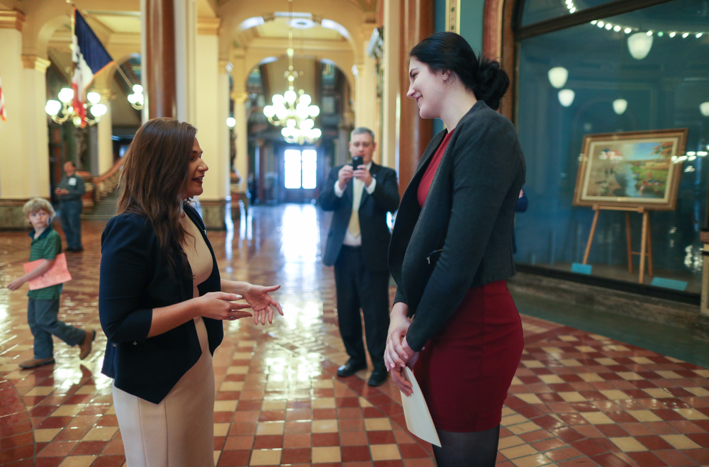 Iowa’s Megan Gustafson meets U.S. Representative Abby Finkenauer in the rotunda at the Iowa State Capitol Wednesday, April 24, 2019 in Des Moines. (Brian Ray/hawkeyesports.com)