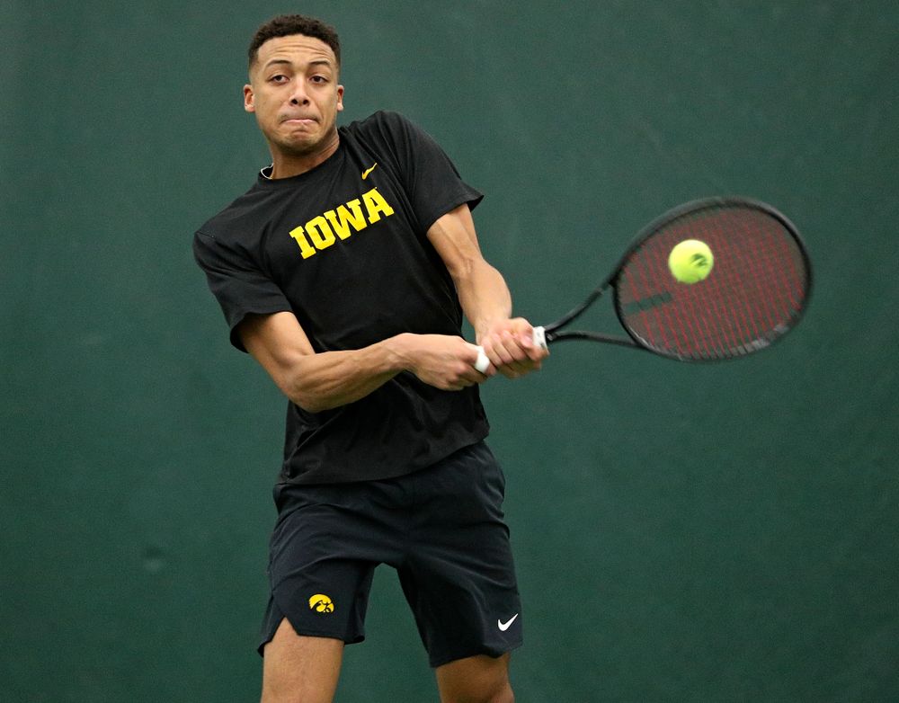 Iowa’s Oliver Okonkwo returns a shot during his doubles match at the Hawkeye Tennis and Recreation Complex in Iowa City on Friday, February 14, 2020. (Stephen Mally/hawkeyesports.com)