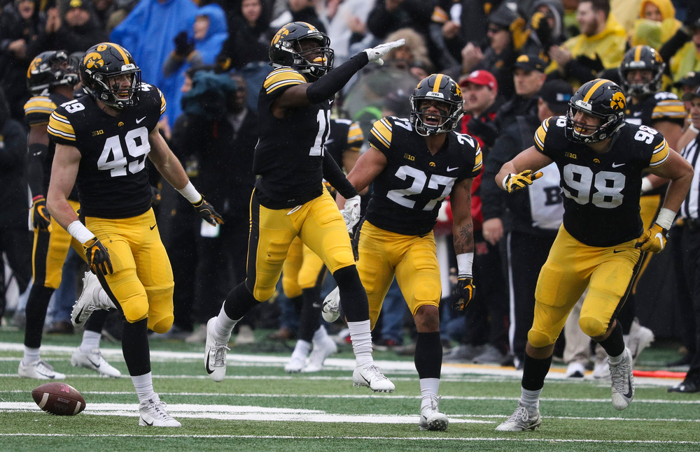Iowa Hawkeyes defensive back Michael Ojemudia (11) celebrates after making an interception during a game against Nebraska at Kinnick Stadium on November 23, 2018. (Tork Mason/hawkeyesports.com)