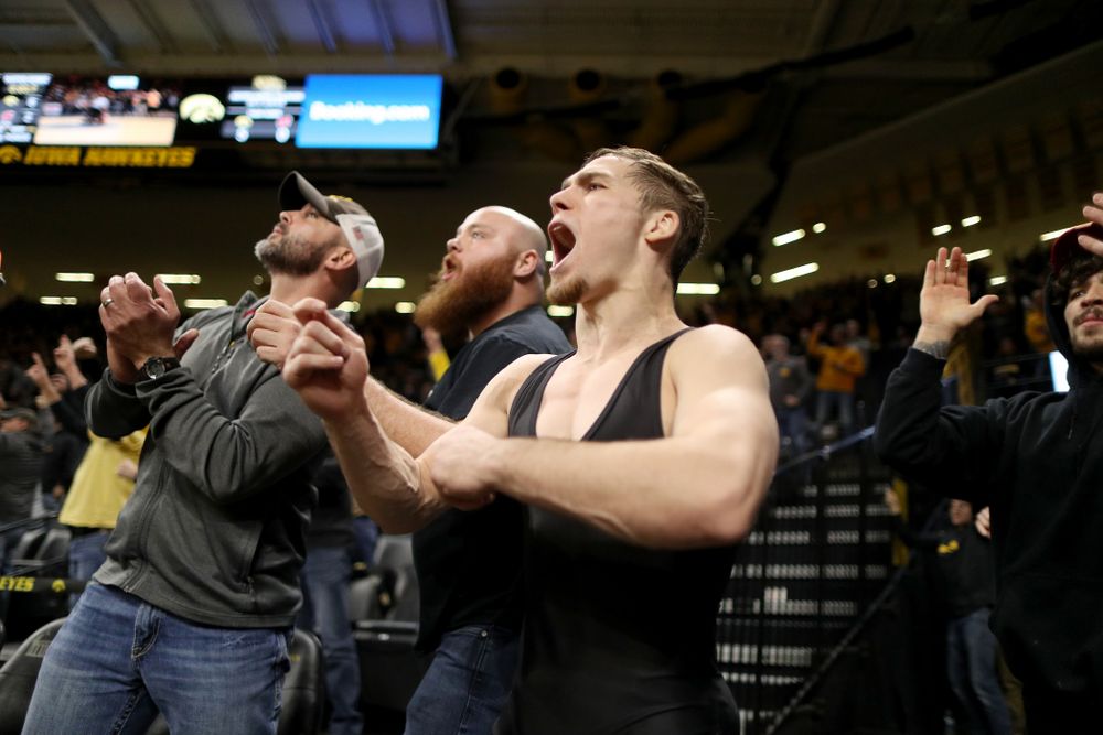 IowaÕs Spencer Lee cheers on teammate Austin DeSanto as he wrestles WisconsinÕs Seth Gross at 133 pounds Sunday, December 1, 2019 at Carver-Hawkeye Arena. DeSanto won the match 6-2. (Brian Ray/hawkeyesports.com)