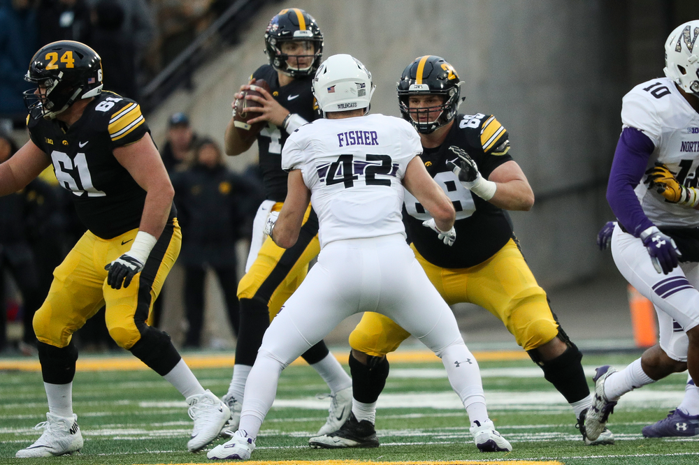 Iowa Hawkeyes offensive lineman Keegan Render (69) blocks during a game against Northwestern at Kinnick Stadium on November 10, 2018. (Tork Mason/hawkeyesports.com)