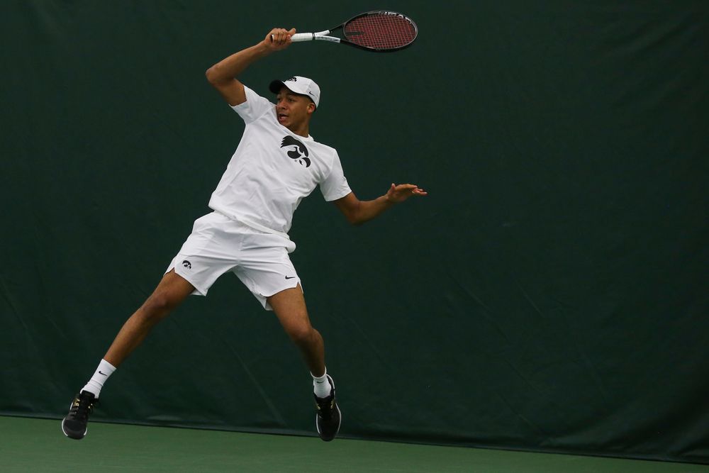 Iowa’s Oliver Okonkwo hits a forehand during the Iowa men’s tennis match vs Western Michigan on Saturday, January 18, 2020 at the Hawkeye Tennis and Recreation Complex. (Lily Smith/hawkeyesports.com)