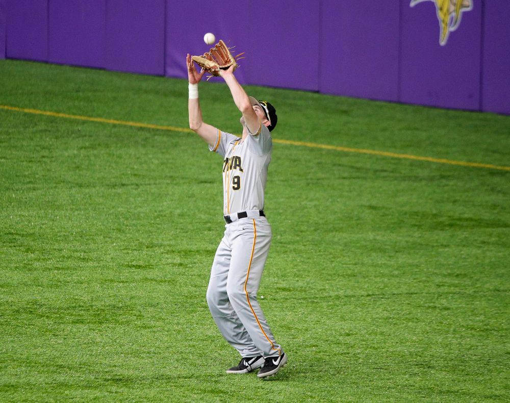 Iowa Hawkeyes outfielder Ben Norman (9) pulls in a fly ball for an out during the second inning of their CambriaCollegeClassic game at U.S. Bank Stadium in Minneapolis, Minn. on Friday, February 28, 2020. (Stephen Mally/hawkeyesports.com)