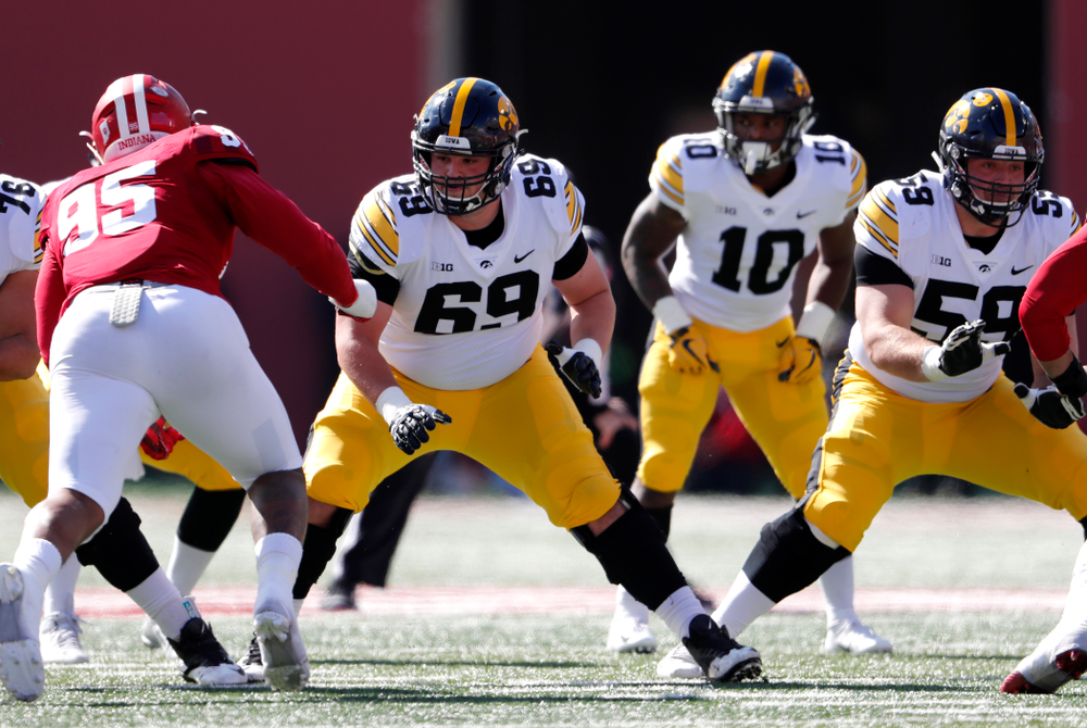 Iowa Hawkeyes offensive lineman Keegan Render (69) and offensive lineman Ross Reynolds (59) against the Indiana Hoosiers Saturday, October 13, 2018 at Memorial Stadium, in Bloomington, Ind. (Brian Ray/hawkeyesports.com)