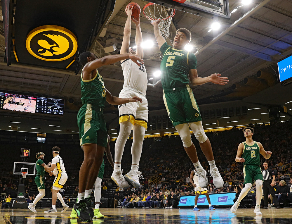 Iowa Hawkeyes forward Ryan Kriener (15) dunks the ball during the first half of their game at Carver-Hawkeye Arena in Iowa City on Sunday, Nov 24, 2019. (Stephen Mally/hawkeyesports.com)