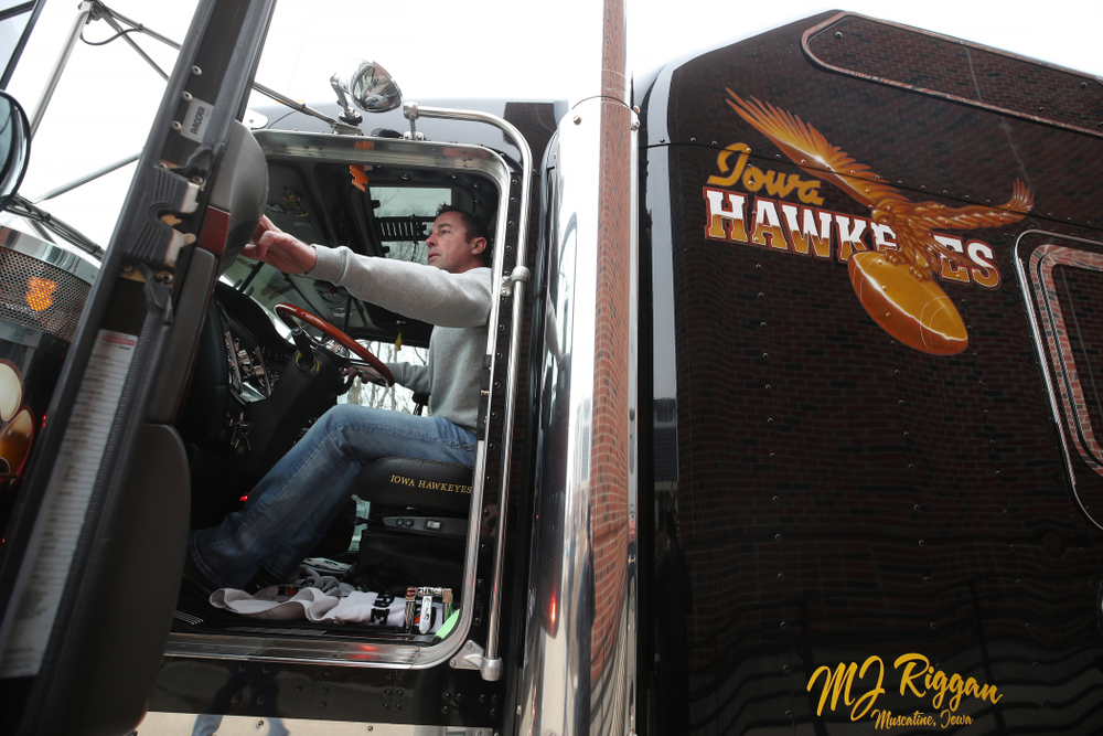 TanTara Transportation Corporation operations manager Jeff Riggan helps hook up Hawk One to the trailer before the truck departed for the Outback Bowl in Tampa, Florida Friday, December 21, 2018 at the Hansen Football Performance Center. (Brian Ray/hawkeyesports.com)