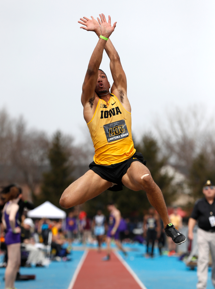 Iowa's O'Shea Wilson competes in the long jump during the 2018 MUSCO Twilight Invitational Thursday, April 12, 2018 at the Cretzmeyer Track