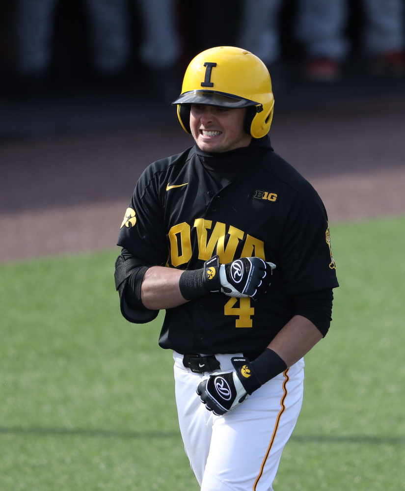 Iowa Hawkeyes infielder Mitchell Boe (4) reacts after hitting a game tying three-run homer against California State Northridge Sunday, March 17, 2019 at Duane Banks Field. (Brian Ray/hawkeyesports.com)