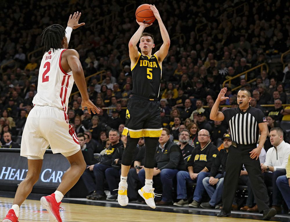 Iowa Hawkeyes guard CJ Fredrick (5) makes a 3-pointer during the first half of their game at Carver-Hawkeye Arena in Iowa City on Monday, January 27, 2020. (Stephen Mally/hawkeyesports.com)
